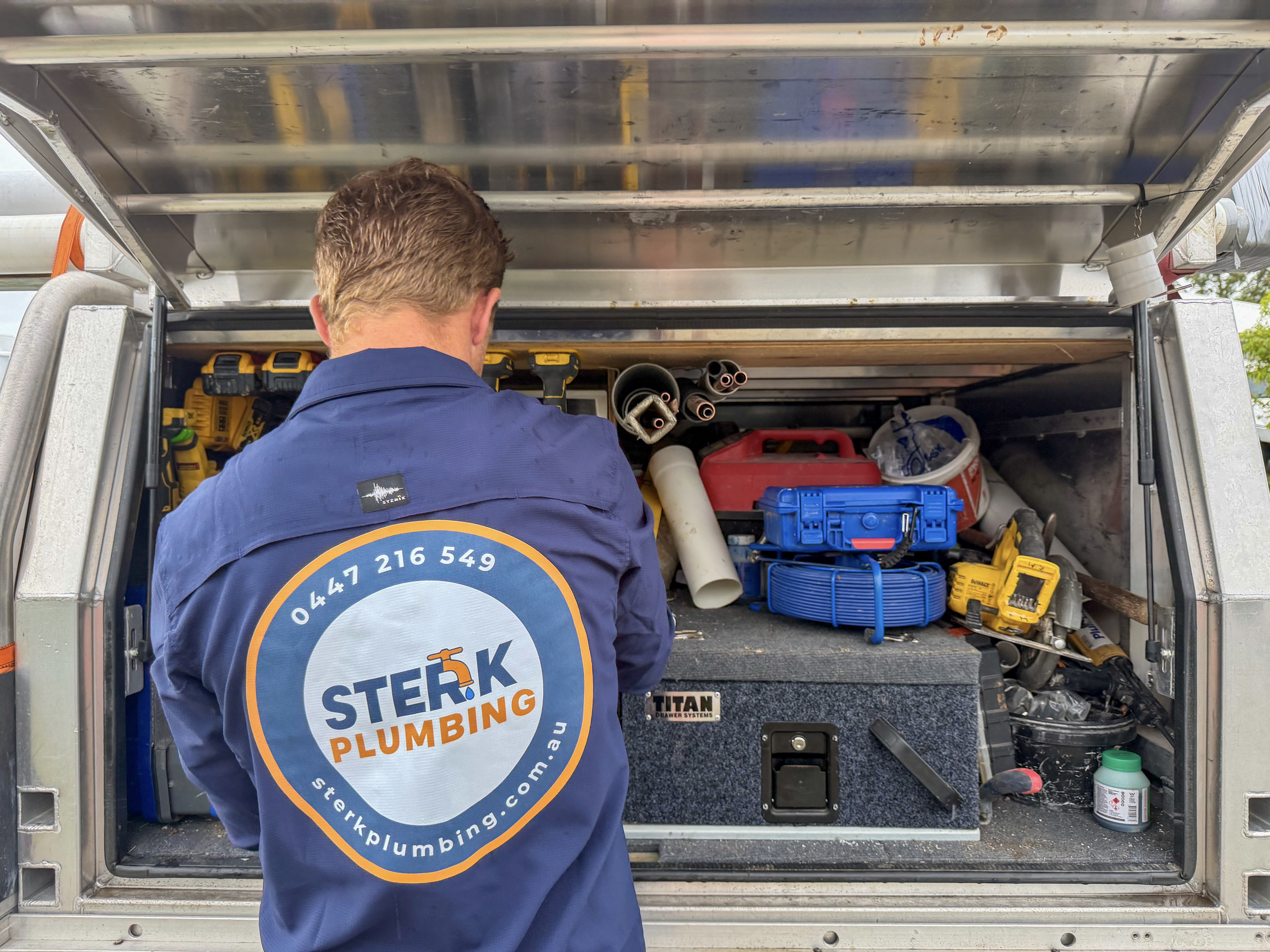 Sterk Plumbing technician with fully-equipped service vehicle on the Sunshine Coast